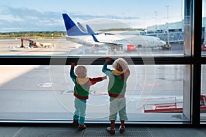 Kids travel and fly. Child at airplane in airport