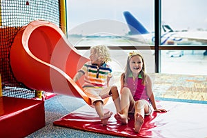 Kids travel and fly. Child at airplane in airport