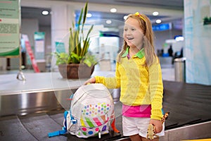 Kids travel and fly. Child at airplane in airport