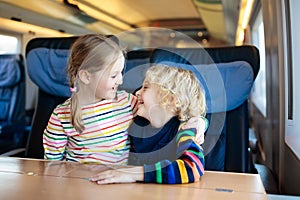 Kids travel by train. Railway trip with child.