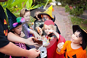 Kids trick or treat. Halloween. Child at door