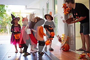 Kids trick or treat. Halloween. Child at door
