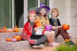 Kids trick or treat. Halloween. Child at door