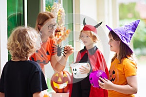 Kids trick or treat. Halloween. Child at door