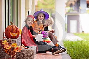 Kids trick or treat. Halloween. Child at door