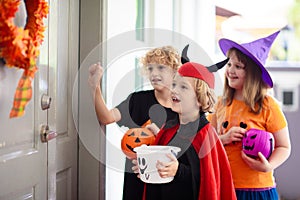 Kids trick or treat. Halloween. Child at door