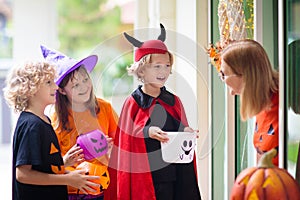 Kids trick or treat. Halloween. Child at door