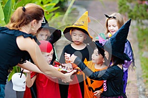 Kids trick or treat. Halloween. Child at door
