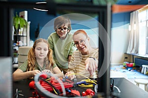 Kids using 3D Printer in Engineering Laboratory