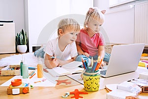 Kids using computer online technology to art creative, drawing or making crafts