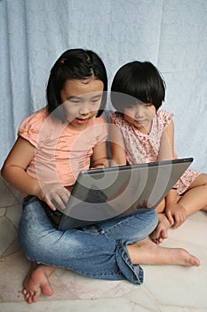 Kids using laptop