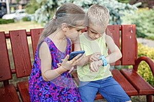 Kids using smartwatches with interest, care and parents control, new technology for children