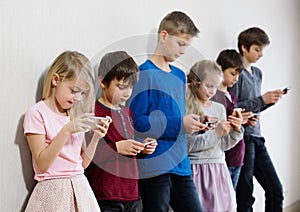 Kids using their mobile phones