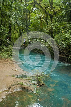 Kids Walking Across River