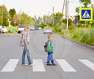 Kids walking on the pedestrian crossing