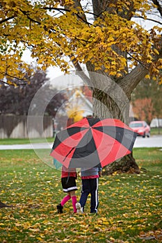 Kids Walking with Umbrella