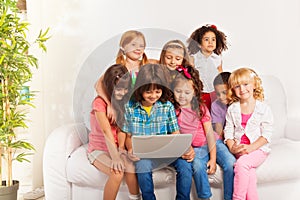 Kids watch movie from laptop