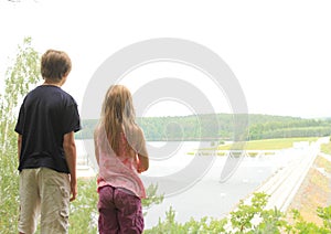 Kids watching a dam