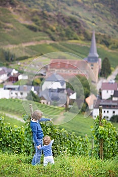 Kids watching view Germany village with old church