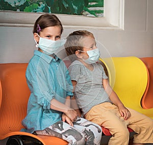 Kids wearing facial disposable mask. Virus protection