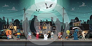 Kids Wearing Monsters Costumes Walking In Town Tricks Or Treat Happy Halloween Banner Holiday Concept