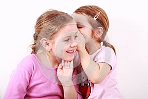 Kids whispering photo