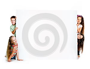 Girles beside a white blank