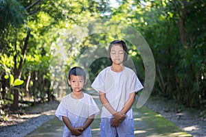 Kids on white clothing , practice walking Meditation in forest t