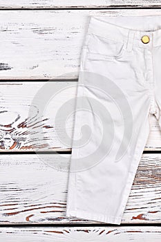 Kids white fashion trousers.