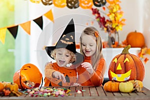 Kids in witch costume on Halloween trick or treat