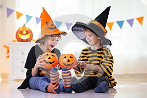 Kids in witch costume on Halloween trick or treat