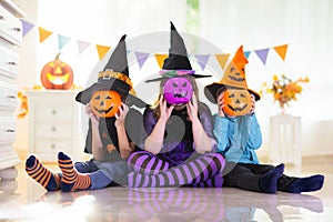 Kids in witch costume on Halloween trick or treat