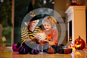 Kids in witch costume on Halloween trick or treat