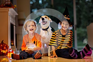 Kids in witch costume on Halloween trick or treat