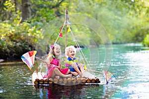 Kids on wooden raft