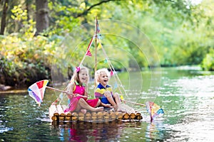 Kids on wooden raft