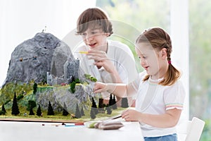 Kids working on model building project for school