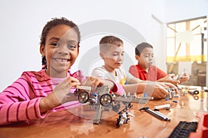 Kids working on project using building kit.