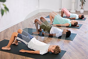 Kids yoga exercise - setu bandha sarvangasana.