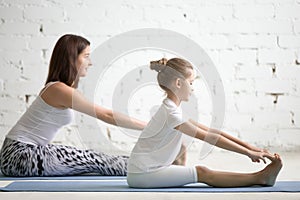 Kids yoga teacher training with a child a paschimottanasana pose