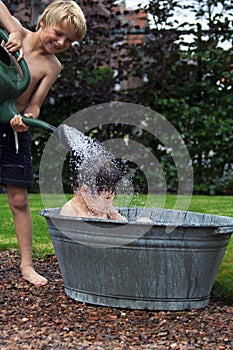 Kids in zinc bathtub