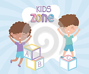 Kids zone, cute little boys playing with alphabet blocks toys