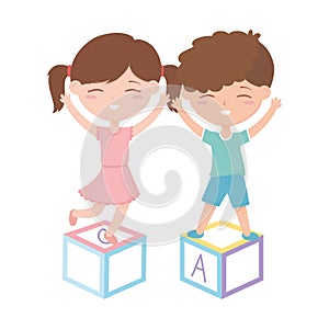 Kids zone, cute little girl and boy playing with alphabet blocks toys