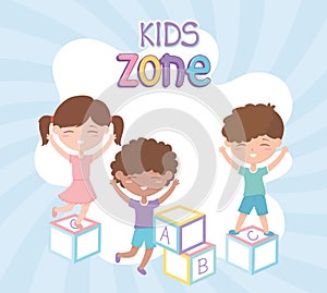 Kids zone, cute little girl and boys playing with alphabet blocks toys