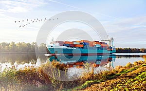 Kiel-Canal with containership in autumn