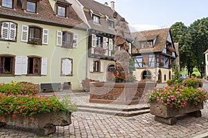 French traditional half-timbered houses in Kientzheim village in Alsace, France