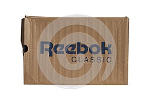 KIEV, UKRAINE-JULY 19,2017: blue Reebok sign with light brown background, Reebok International Ltd. - Sports shoe and sewing compa