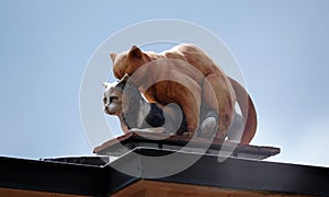 Sculpture cat has sex with a cat