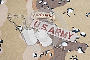 KIEV, UKRAINE - May. 02, US ARMY airborne tab with blank dog tags on camouflage uniform