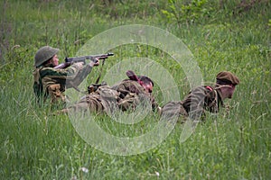 Kiev, Ukraine - May 09, 2018: Men in the form of American and British soldiers instigate a battle during historical reconstruction